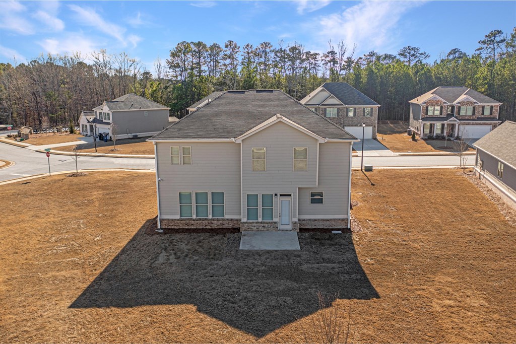 an aerial view of a house in a neighborhood