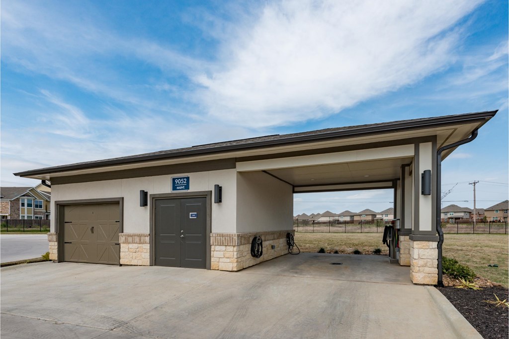 the preserve has a garage with a door and a driveway