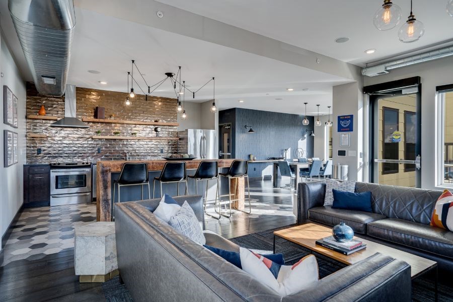 a large living room with a kitchen and a dining room