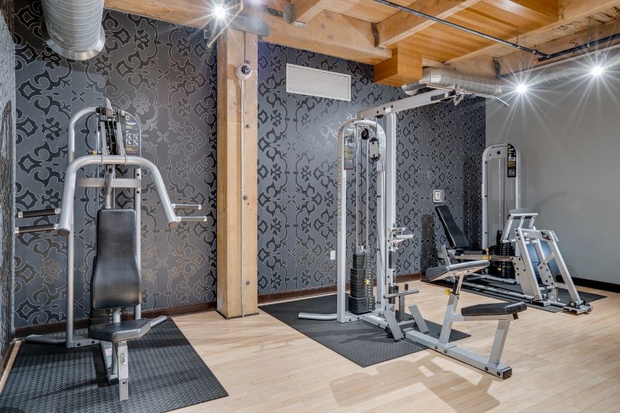 Gym with various weightlifting equipment