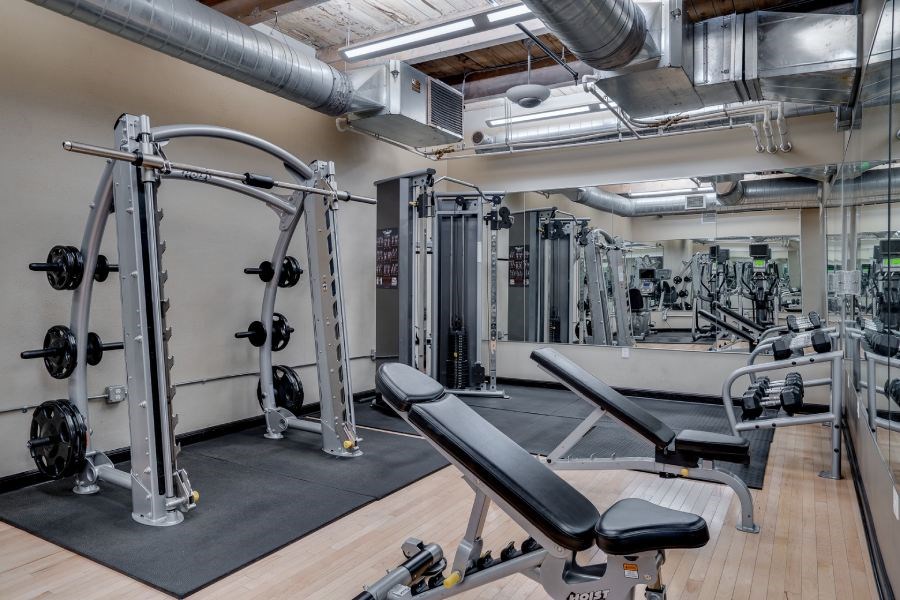 Gym with various weightlifting equipment