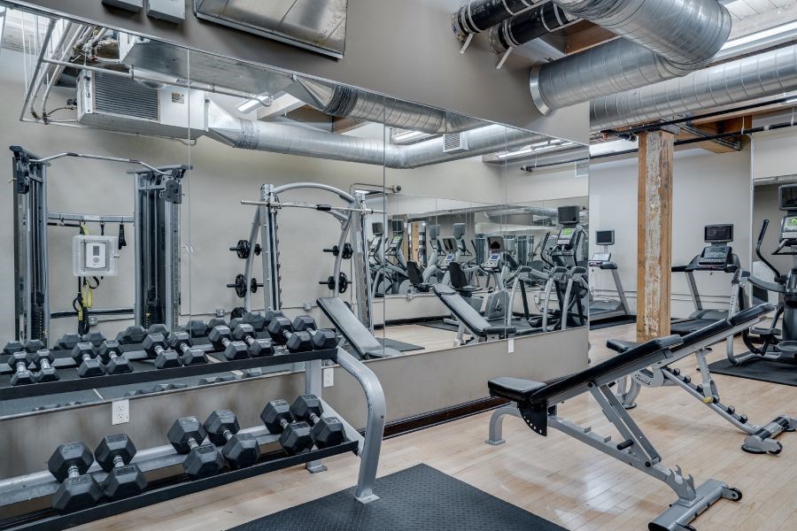 Gym with large mirrors and weights