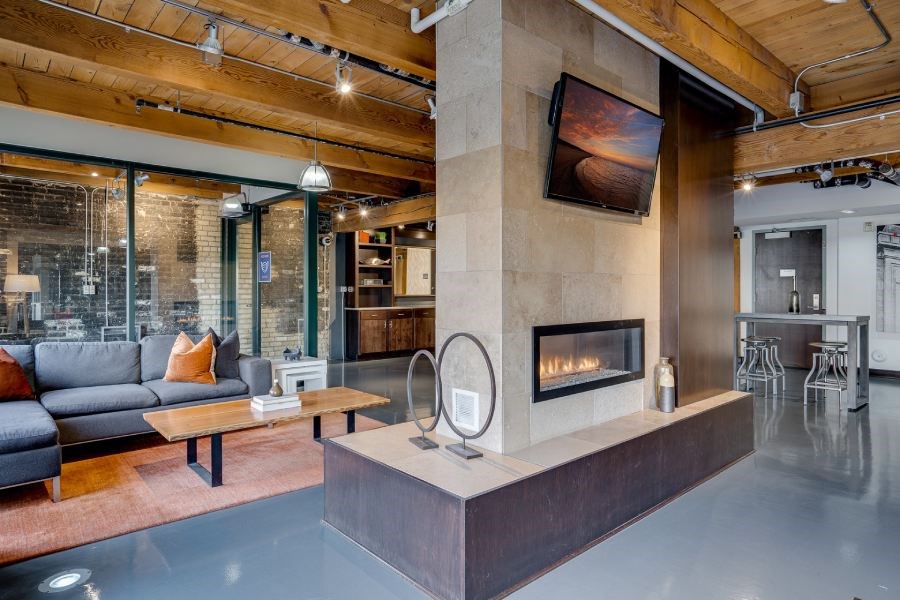 Urban industrial lobby with exposed wood and brick in historic building