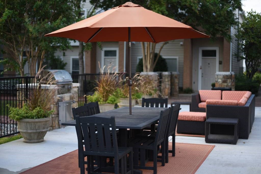 Outdoor Lounge Area with Grills and Seating