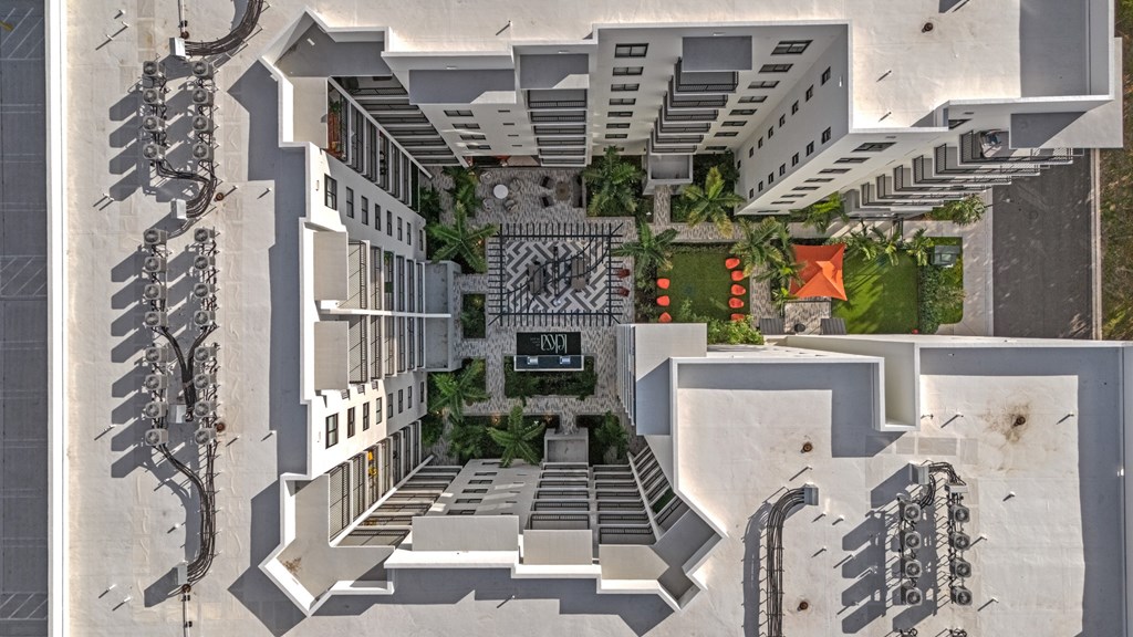 A modern building with a courtyard and a fountain.