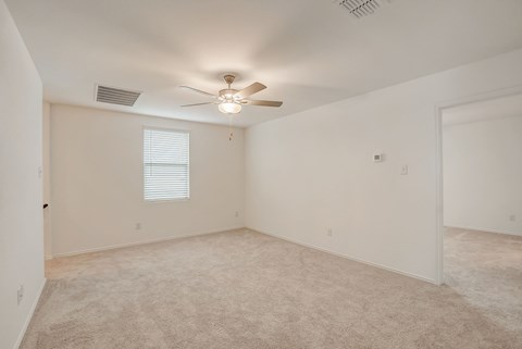 Carpeted upstairs area leading to a bedroom, offering a comfortable and cozy transition to the sleeping quarters