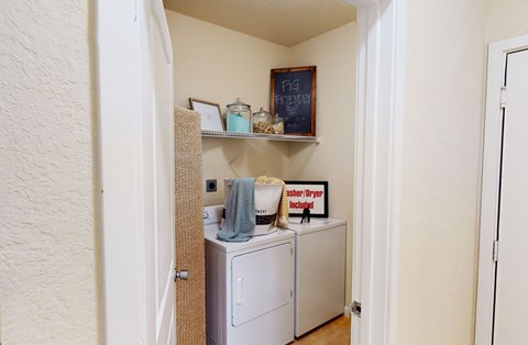 a laundry room with a washer and dryer in it