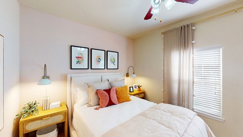 a bedroom with a bed and a ceiling fan