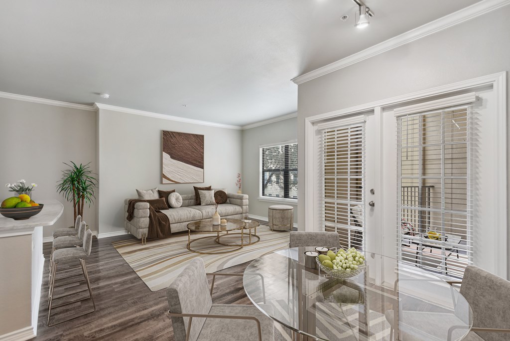 a living room with a couch and a glass table
