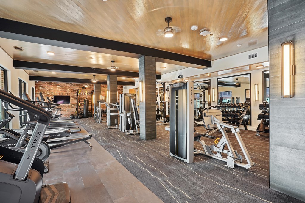 a gym with cardio equipment and strength training area in roanoke