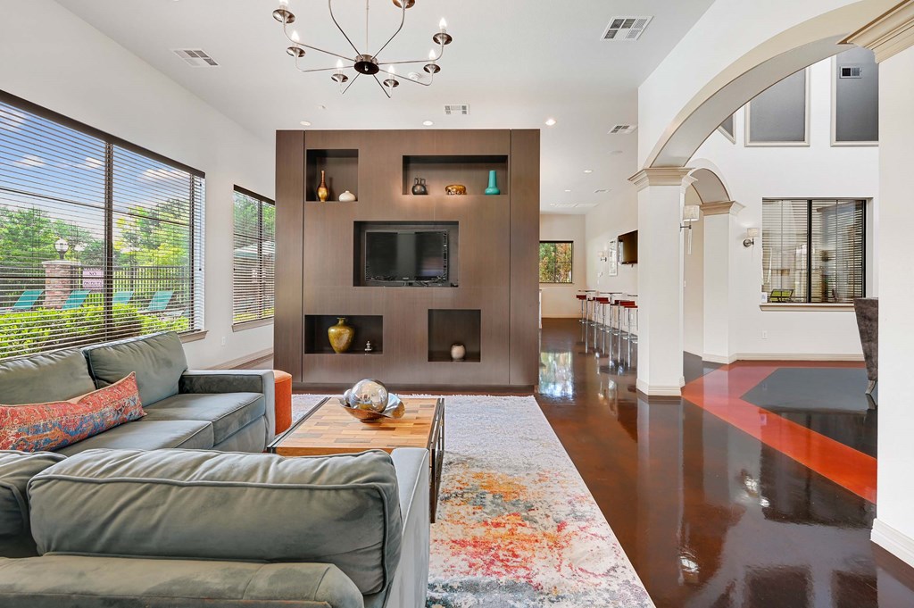 a living room with couches and a coffee table and a fireplace