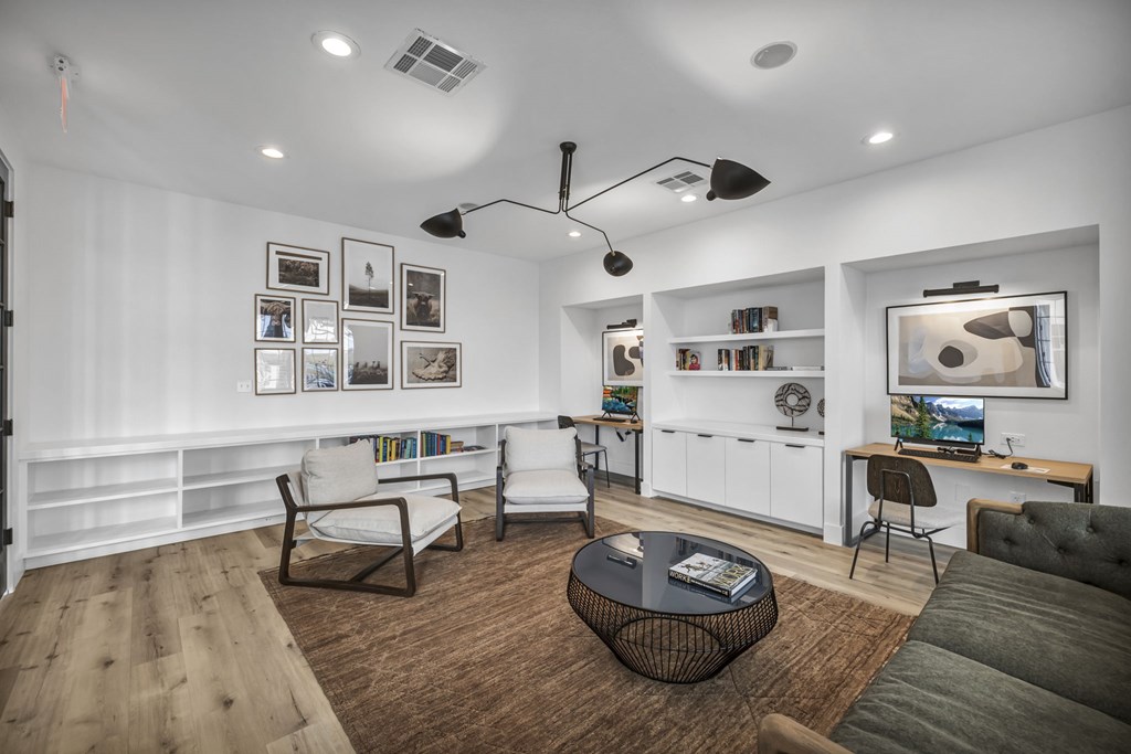 a living room filled with furniture and a large window