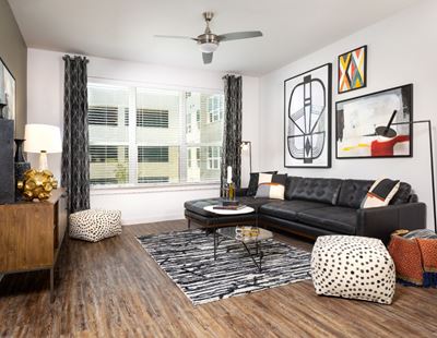 Parkside at Round Rock Living Room Interior with Wood Style Floor and Ceiling Fan