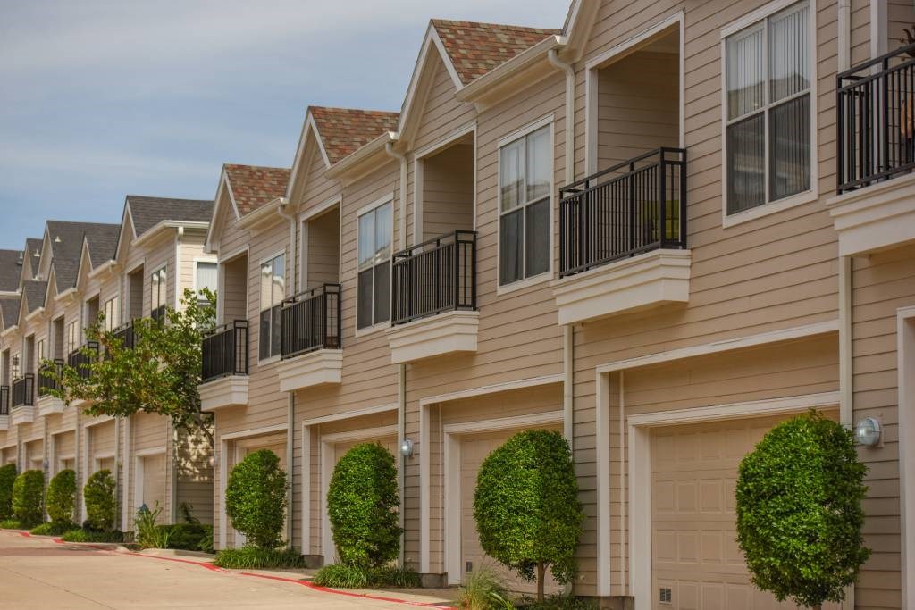 Townhomes with attached garages and balconies