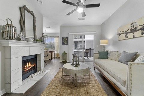 a living room with a fireplace and a couch