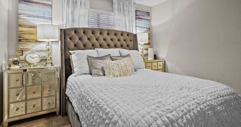 a bedroom with a large bed and a window