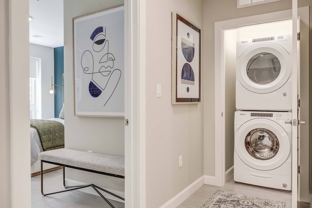 A laundry room with a washer and dryer in it.