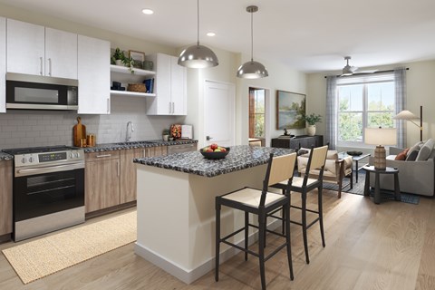 A modern kitchen with a granite countertop and wooden flooring.
