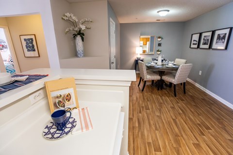 A dining room with a table set for two.