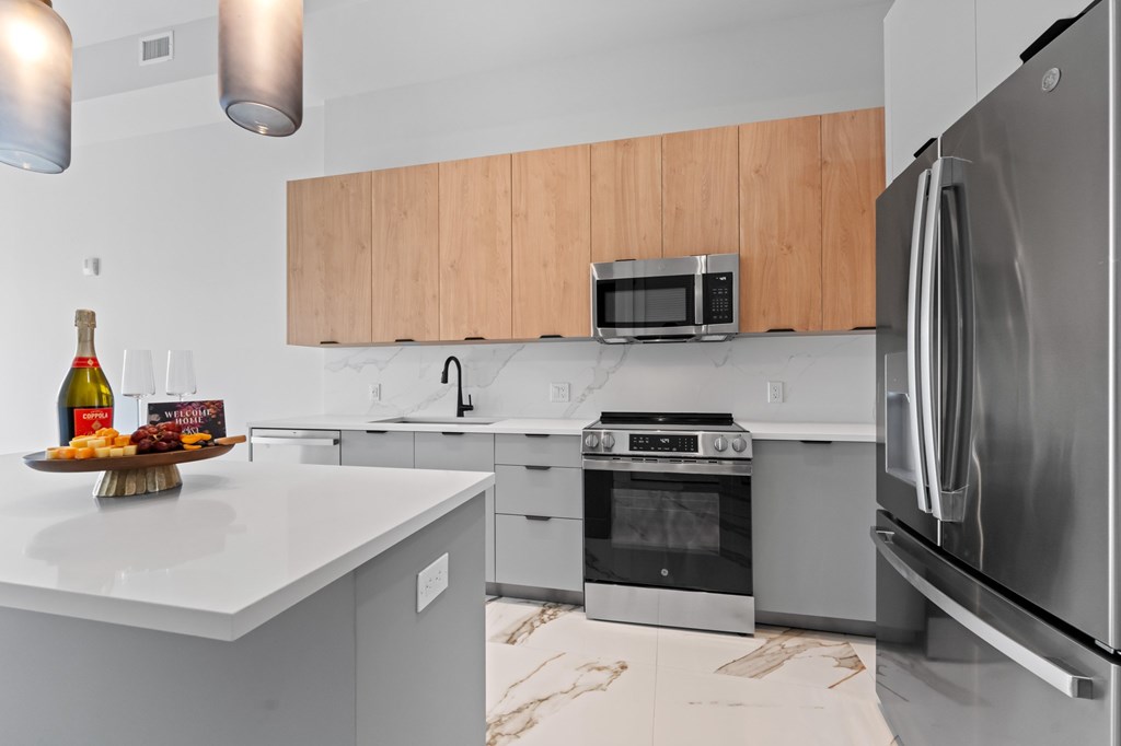 Penthouse floorplan with upgraded fixtures and Marble-effect porcelain flooring