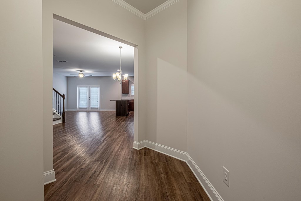 a view of a living room and dining room from the entrance of a house