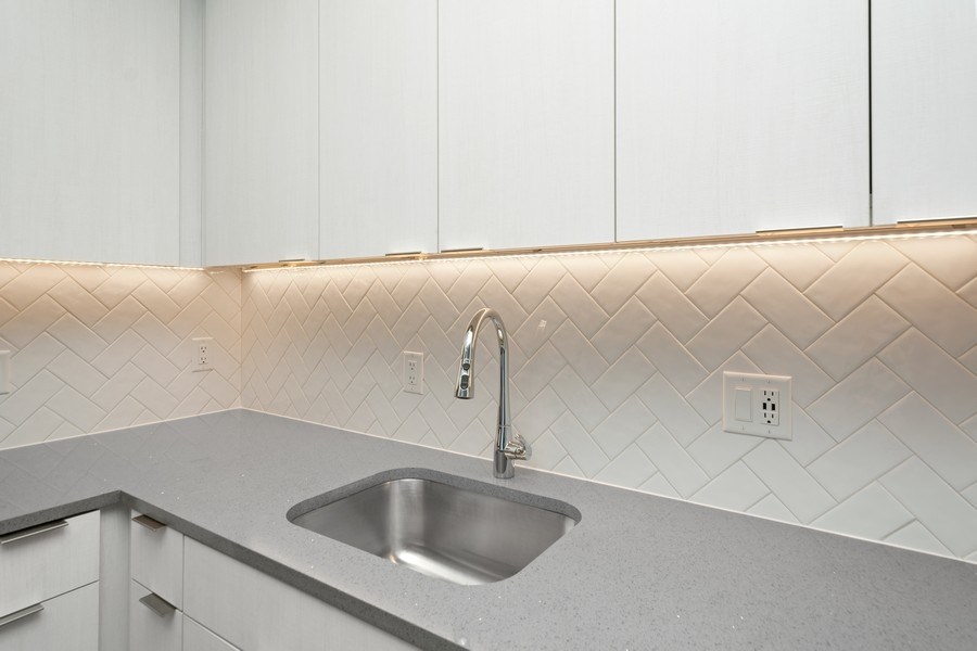 a bathroom with a sink and a faucet