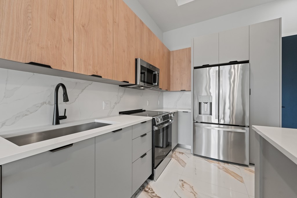 Penthouse floorplan with upgraded fixtures and Marble-effect porcelain flooring