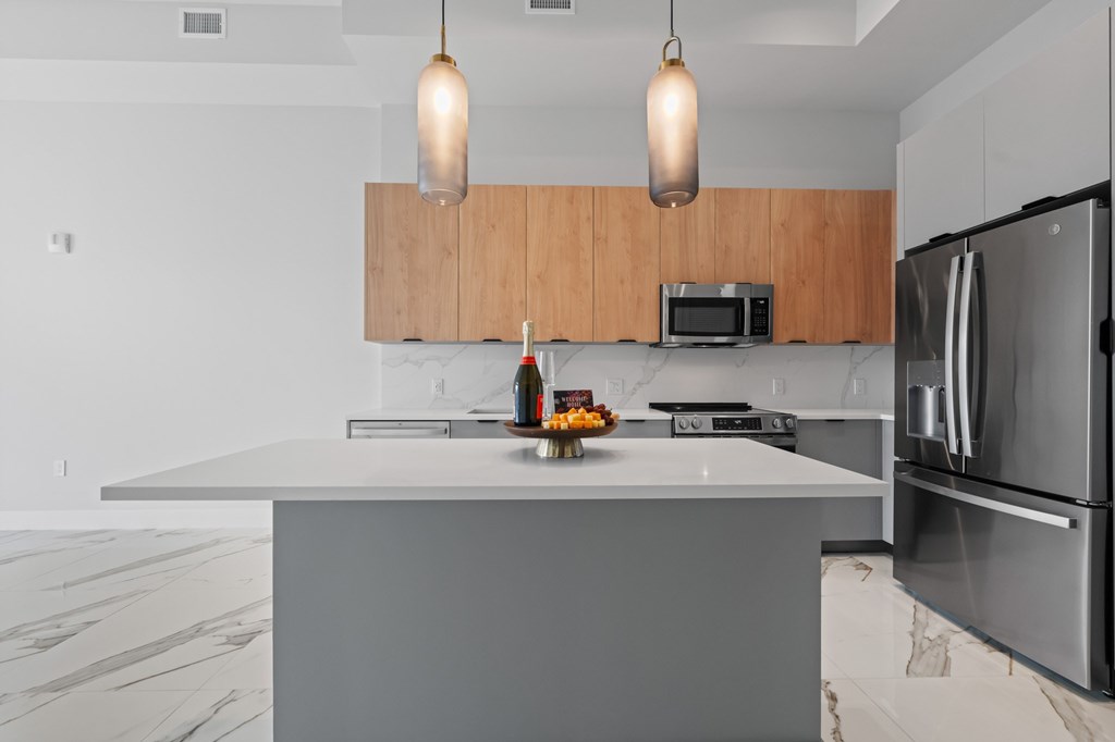 Penthouse floorplan with upgraded fixtures and Marble-effect porcelain flooring