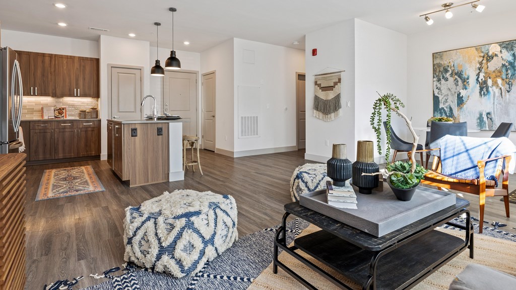 View of kitchen and entryway from living room