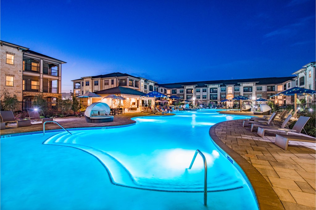 a swimming pool at night at the resort at night