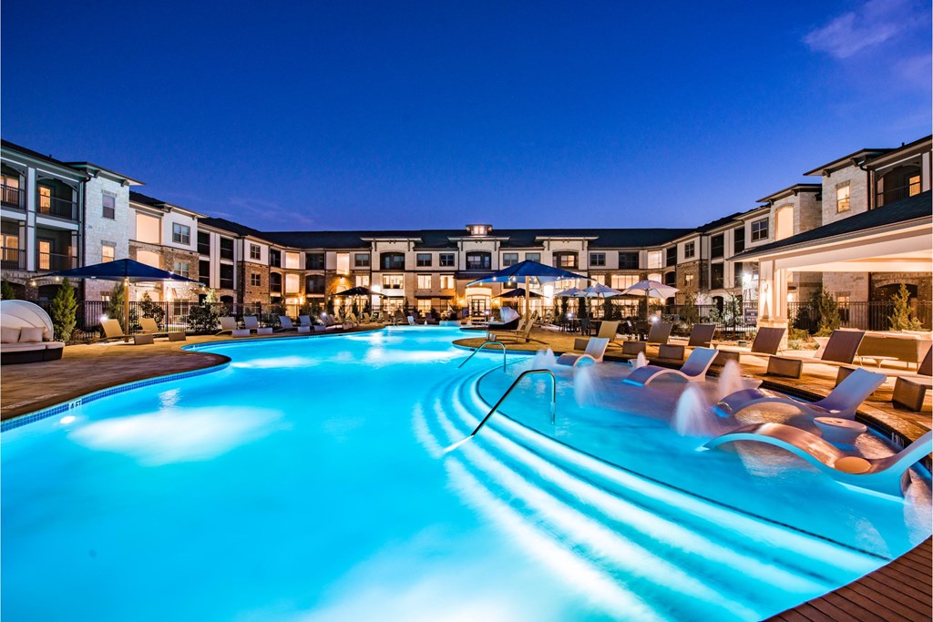 a swimming pool at night at the resort at night