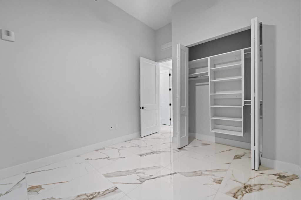 Spacious Penthouse floorplan with upgraded fixtures and Marble-effect porcelain flooring and custom closets