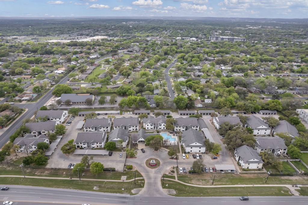 an aerial view of a neighborhood of houses and trees