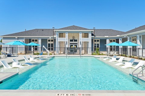 Resort style saltwater Pool with tanning deck at Haven at Treeline Apartments in Tomball, Tx located at 17448 N Eldridge Pkwy, Tomball, TX 77377