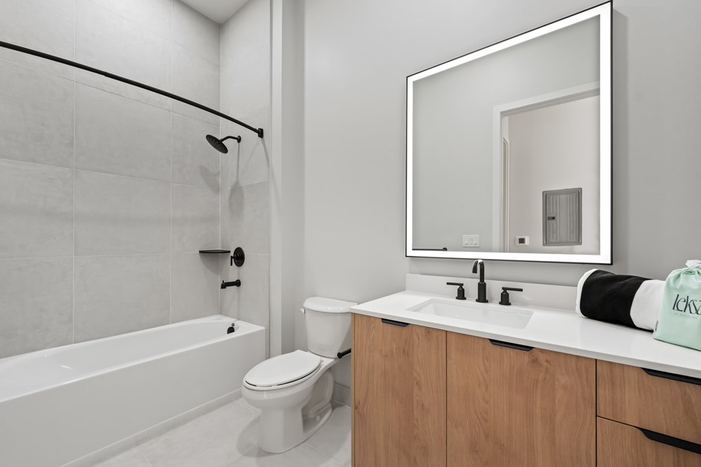Penthouse white bathroom with high end features and Mable flooring
