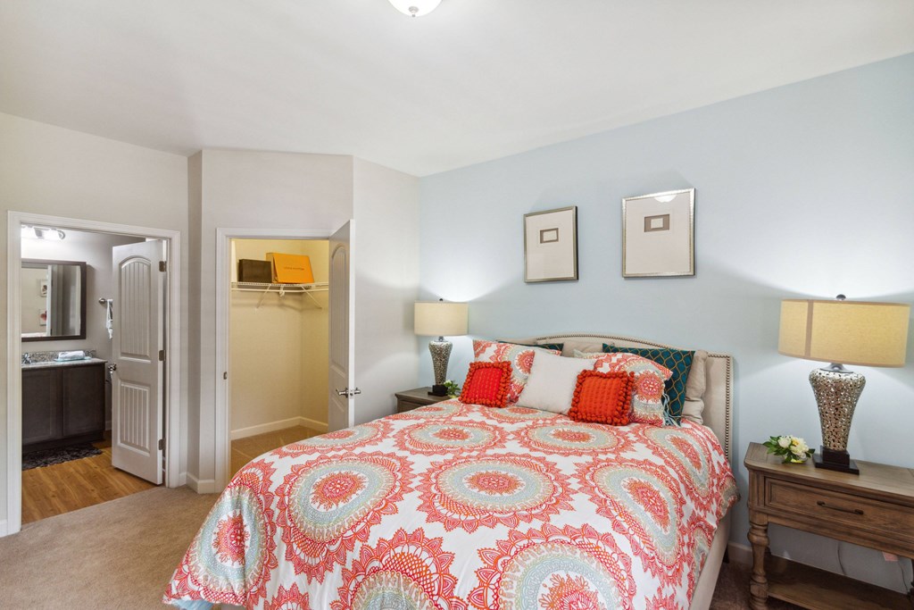 a bedroom with a bed and two night stands