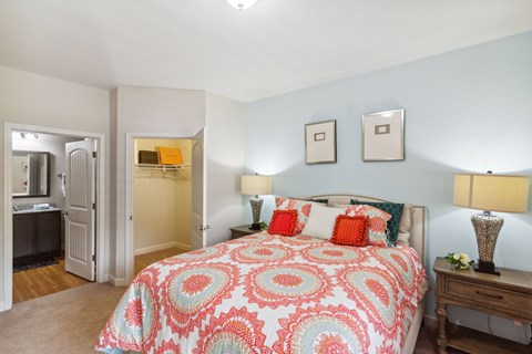 a bedroom with a bed and two night stands