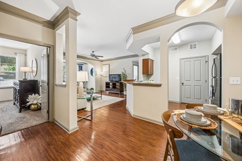A dining room with a table set for two.