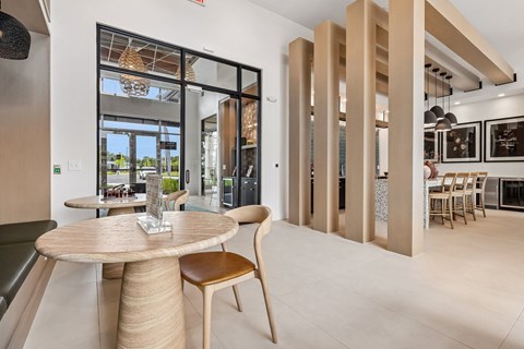 A modern dining area with a round table and chairs.