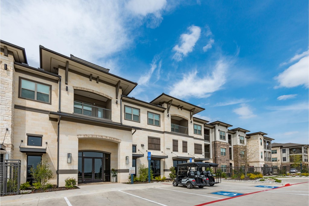 a building with a parking lot with a golf cart in front of it