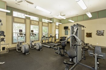 Fitness Center The Grove at Waterford Crossing Apartments Fitness Center with Elliptical, Free Weights, Treadmill, and More - Photo Gallery 6