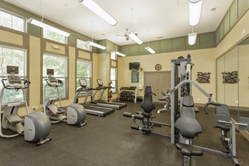 Fitness Center The Grove at Waterford Crossing Apartments Fitness Center with Elliptical, Free Weights, Treadmill, and More - Photo Gallery 5