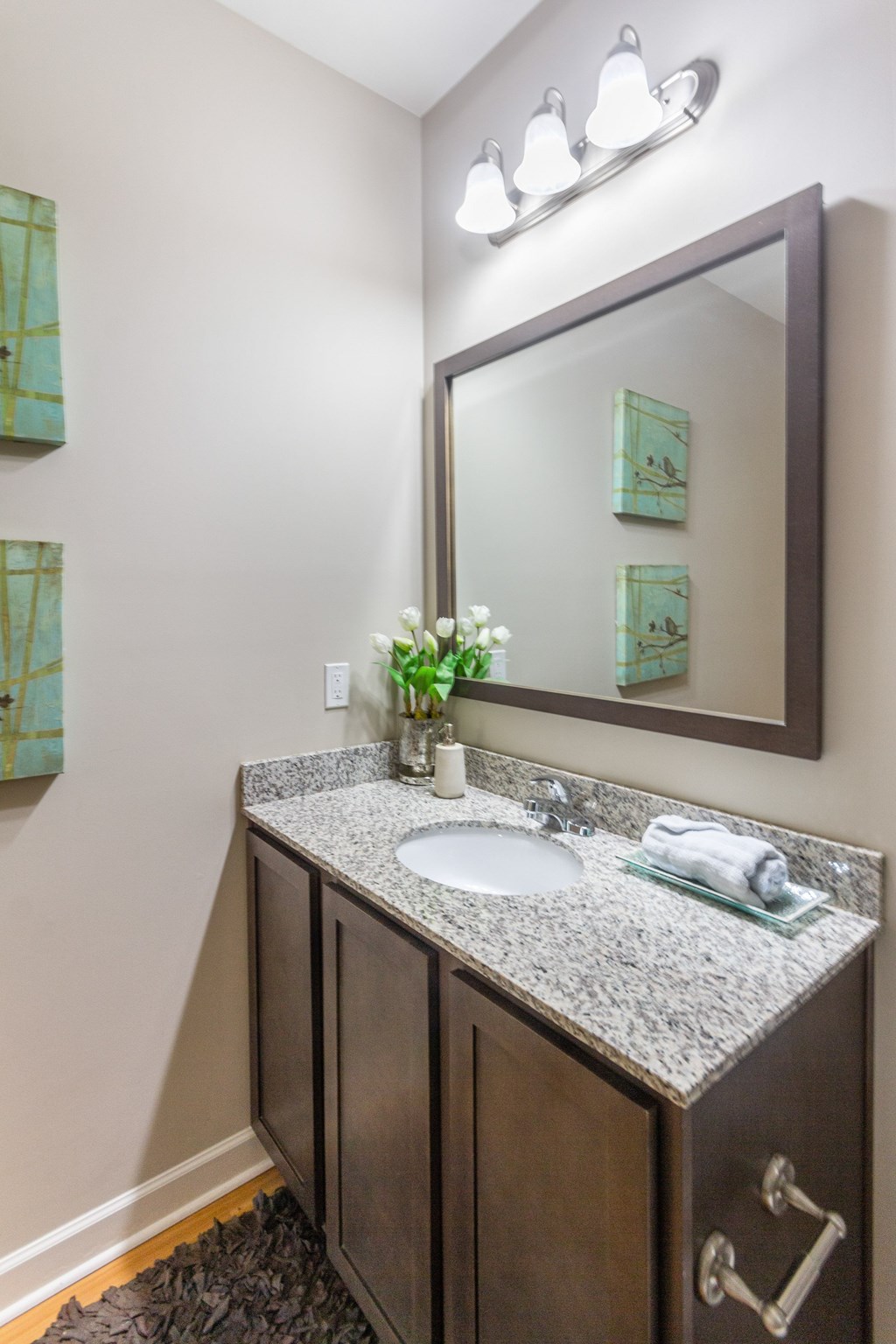 a bathroom with a sink and mirror