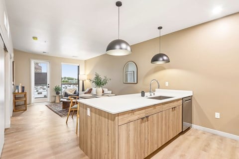 A kitchen with wooden cabinets and a white countertop.