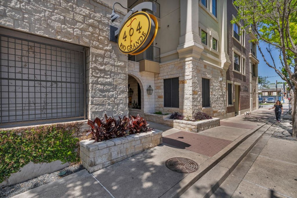 a building with a yellow clock on the side of it