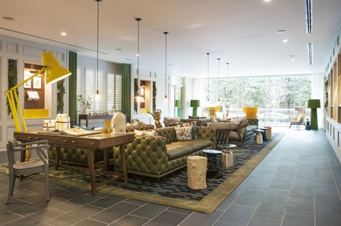 a living room filled with furniture and a large window