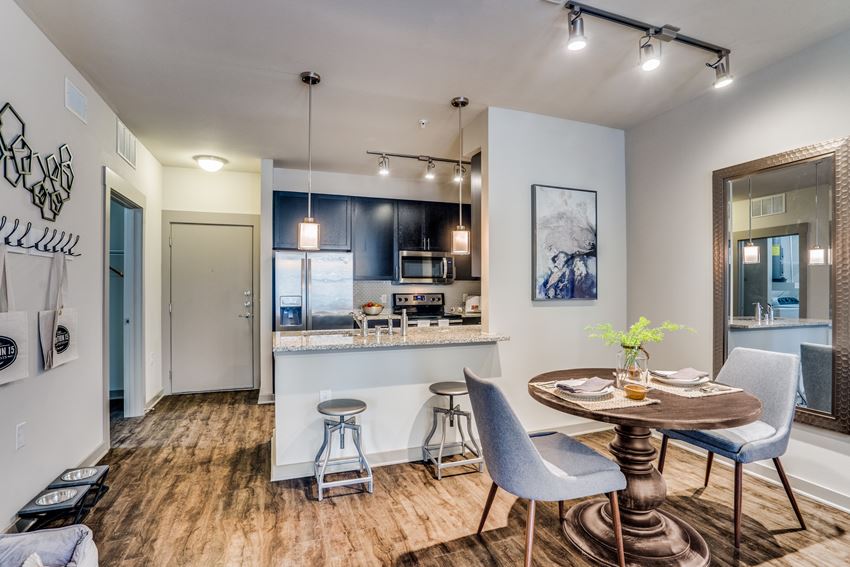 modern dining room with wood plank flooring
