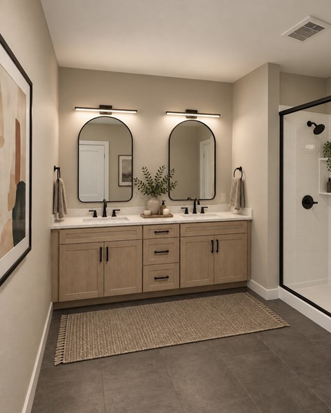 A bathroom with two sinks and two mirrors.