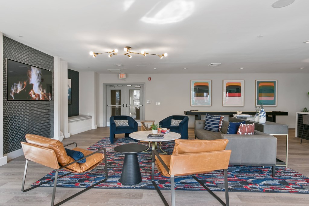 a living room with a couch and chairs and a table