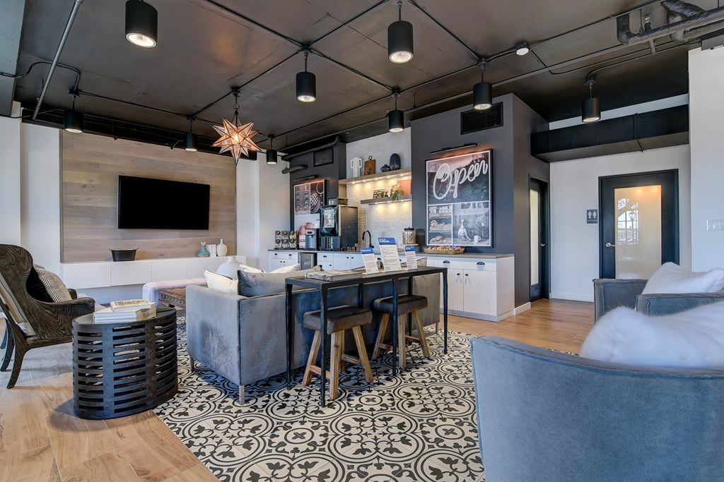 a living room with a bar and a couch and a table